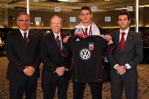 Perry Kitchen poses with team executives, who did a great job yesterday of getting their preferred player later than expected.