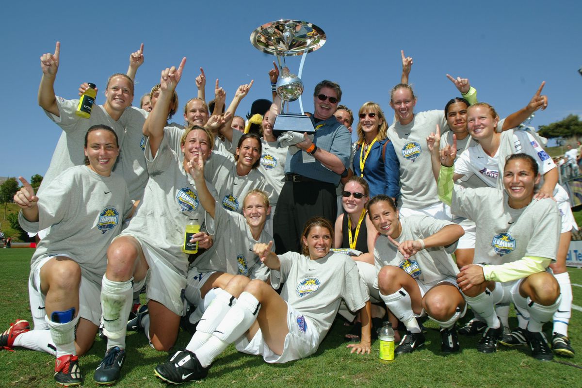 Freedom pose for a photo with the Founder's Cup trophy